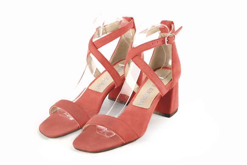  elegant sandals with crossed straps across the instep, closed at the back. . .